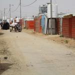 The spatial governance of the Syrian refugee crisis in Jordan: Refugees between urban settlements and encampment policies